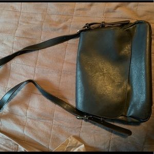 Boutique leather messenger bag. Adjustable straps.